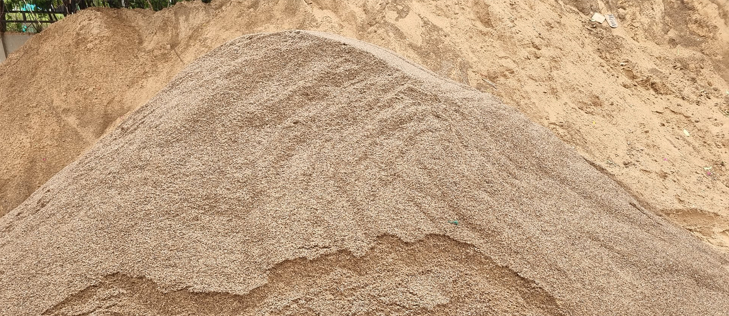 Bulk construction sand delivery at construction site in Gurgaon
